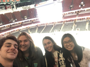 4 students smile for a selfie