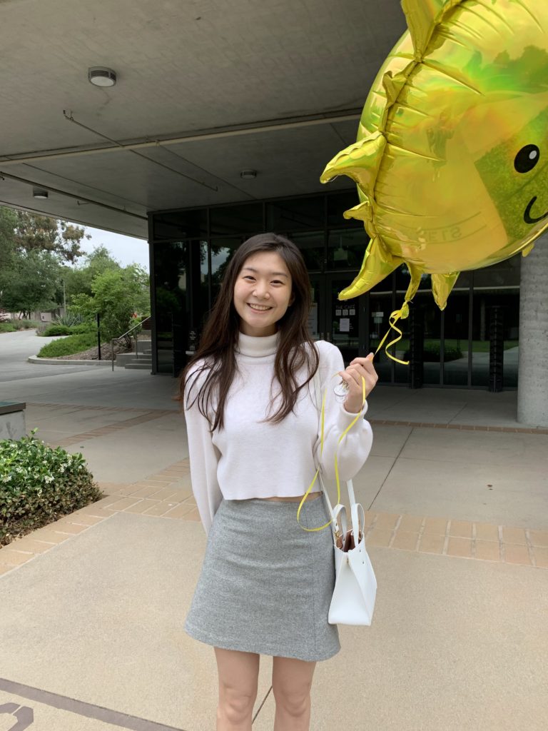 Jenny holding a balloon