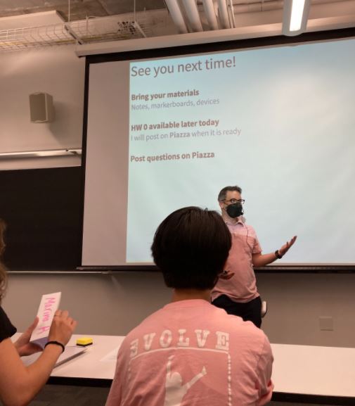 A Professor in front of a screen