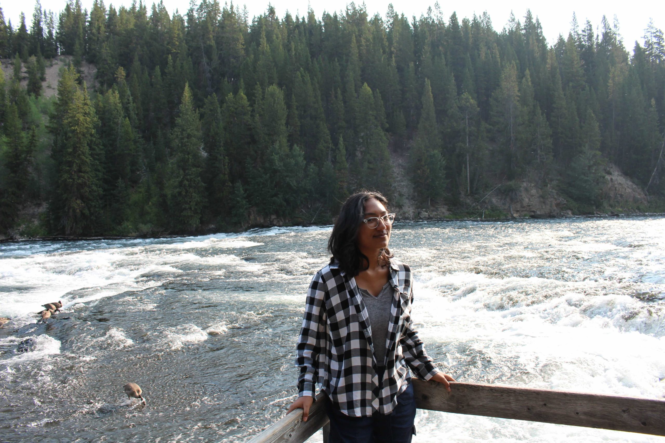 Udeema standing next to a river