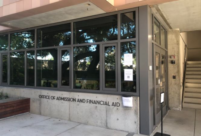 Photo of the outside of an office with text reading "Office of Admission and Financial Aid"