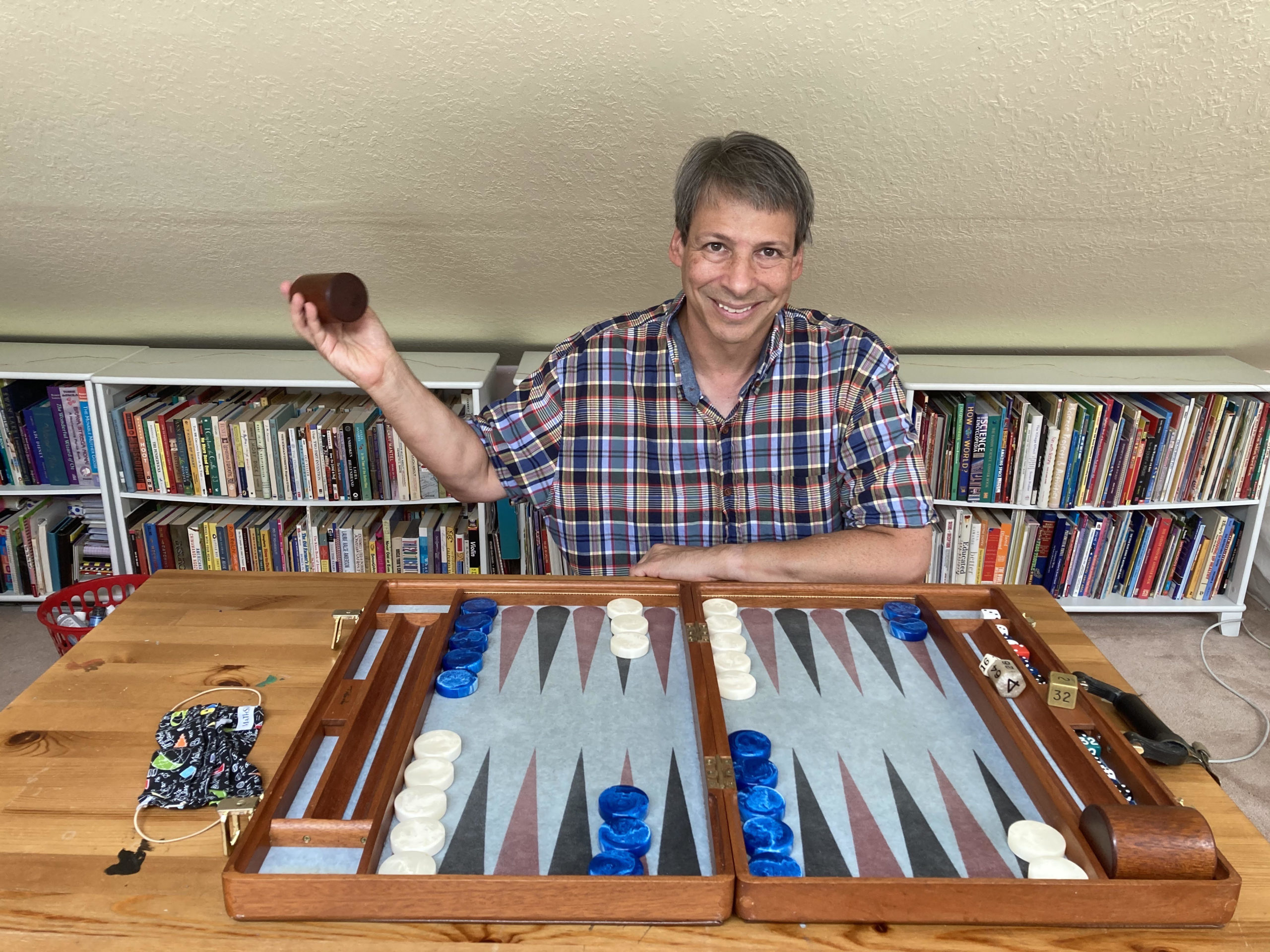 Art Benjamin at table with backgammon board.
