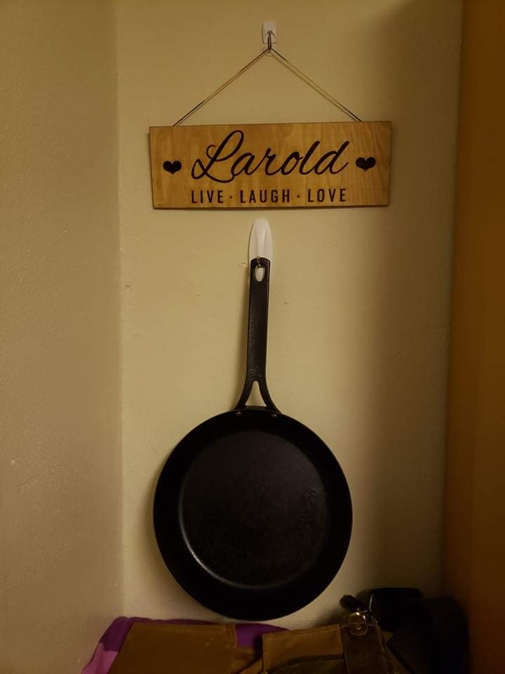 A wooden name plate reading "Larold: Live, Laugh, Love"