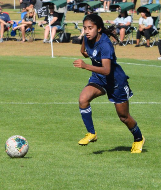 Player in blue dribbling 