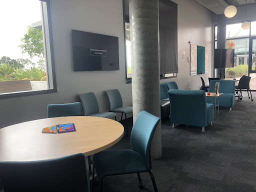 A table with a colorful puzzle and several chairs