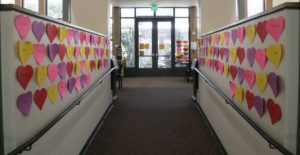 Image of paper hearts on walls. 
