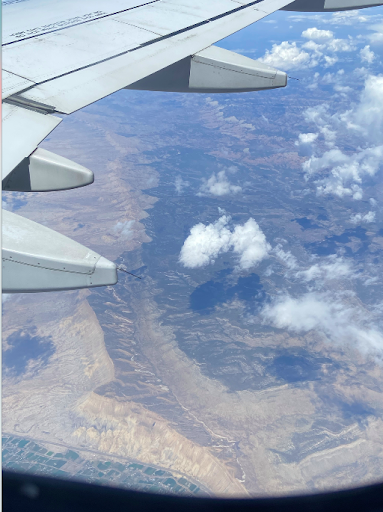 Photo of a plane wing in flight