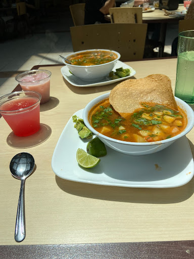 Bowl of soup with a tortilla