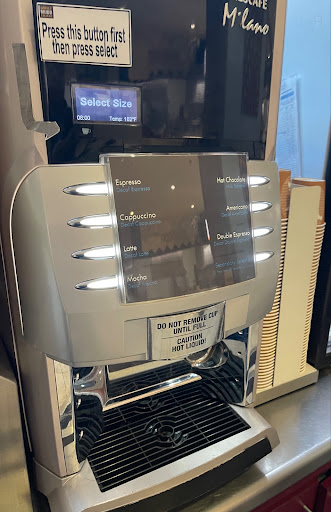 A drinks machine with buttons and labels for coffee and hot chocolate