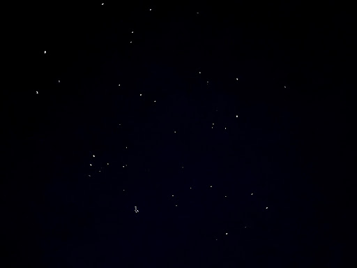 stars that look like white dots against a completely black night sky
