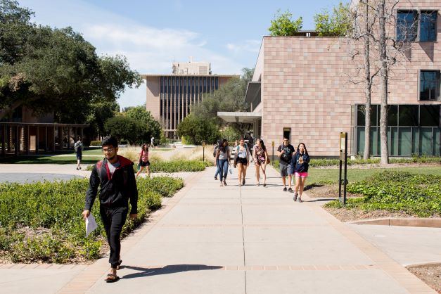 Photo of buildings with students walking