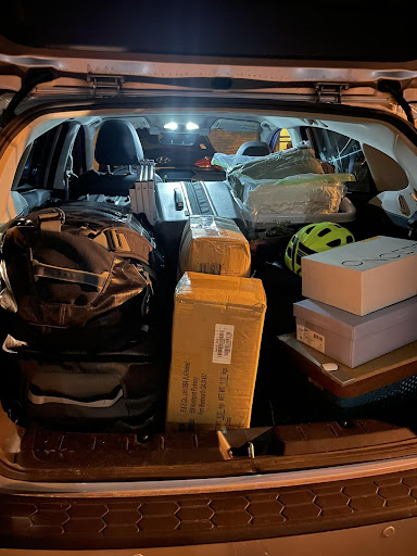 The trunk of a car filled with boxes