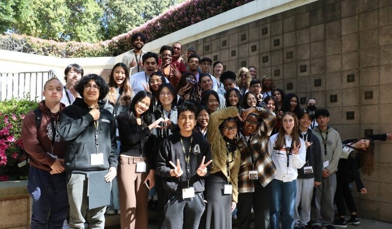 PSP finalists on stairs in Hixon Court posing for photo.