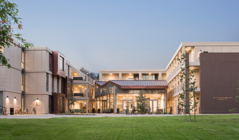 Photo of Drinkward Residence Hall close to dusk. 
