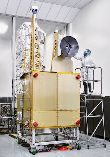 Christopher Kotcherha works on satellite in lab