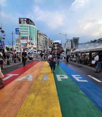 Shanni Lam on Pride-painted street
