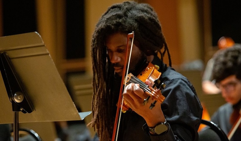 Obosa Obazuaye playing violin