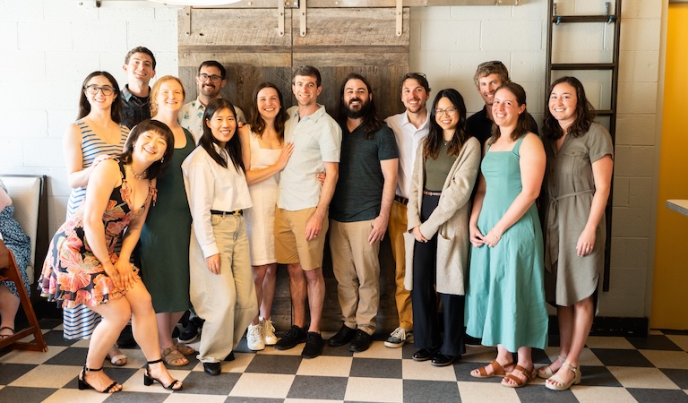 Group photo including Elinson and Paige