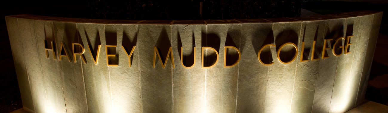 Harvey Mudd College sign lit up at night.