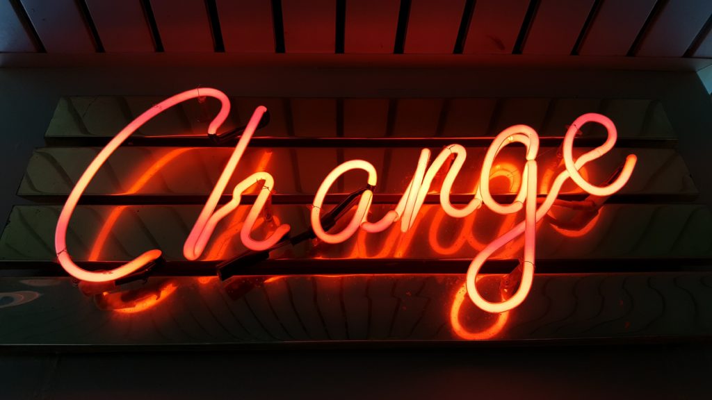 neon sign reading "change" Photo by Ross Findon on Unsplash