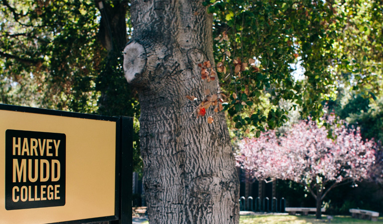 Harvey Mudd College campus sign and trees