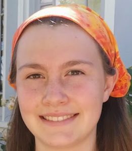 Head pic of Myhre Fellow Natalie Couch '24 in an orange head bandana