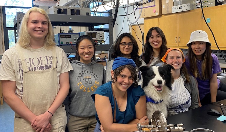 Prof. Hernandez-Castillo and her lab group including service dog