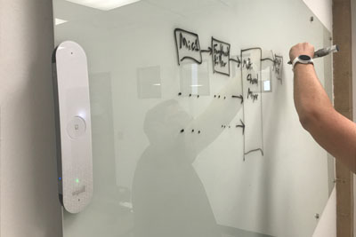 Using the SmartMarkers on a glass whiteboard.