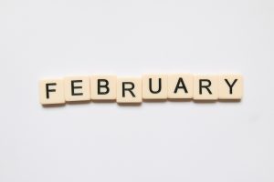 Scrabble tiles spell out February