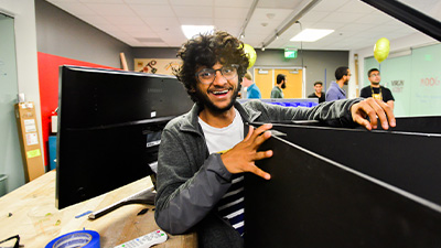 Student holding up black panels.