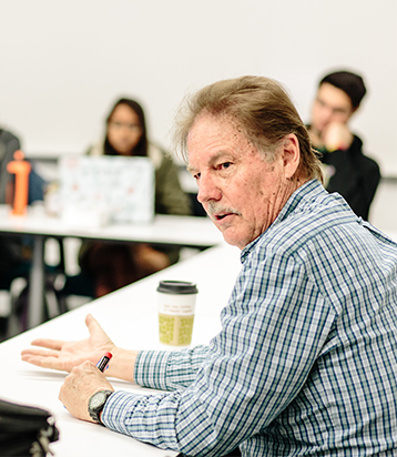 Gary Evans lecturing to a class.