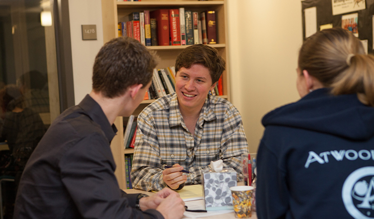 Students talking in the Writing Center.