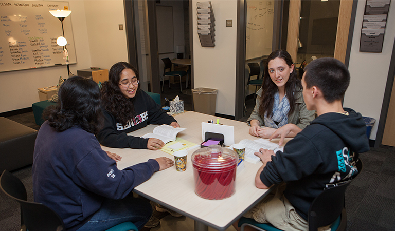 Students discussing in the Writing Center.
