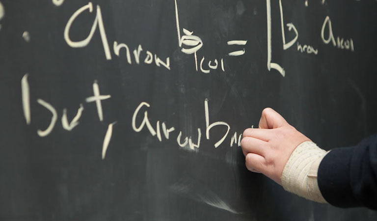 Hand writing on chalkboard