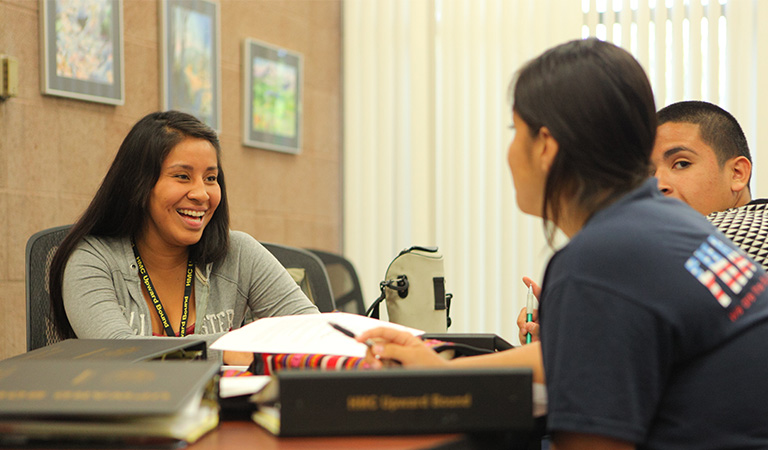 Upward Bound students sitting at a table.