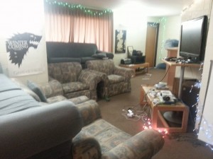Here is a view of suite in the light. Notice the luxury stadium seating complemented with couches and armchairs. Our state-of-the-art entertainment center includes a Nintendo Wii, Xbox 360, and a five year old 42" television complete with a frayed HDMI cord for watching movies and TV shows.